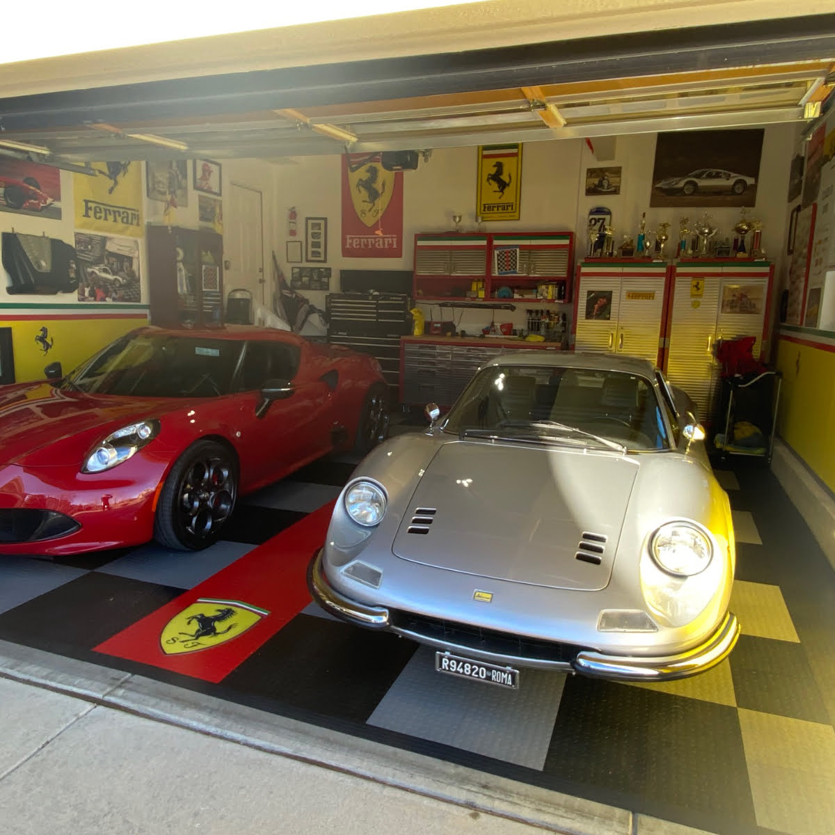 Ferrari cars sitting on our Coin top black, gray and red tiles.