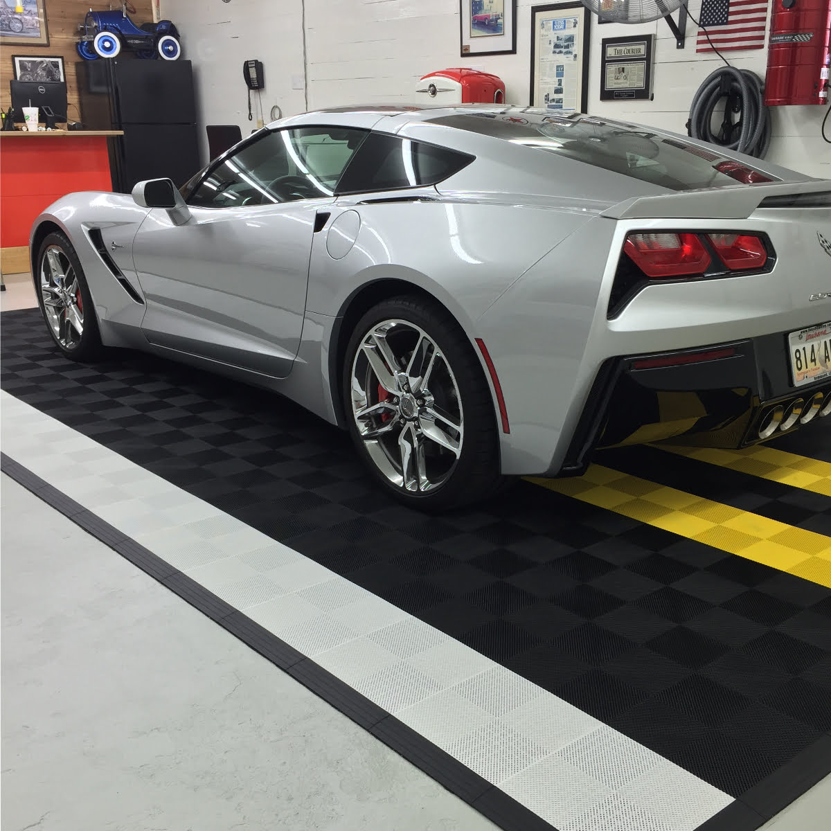 Corvette on a mat with our interlocking Perforated black, white and yellow tiles.