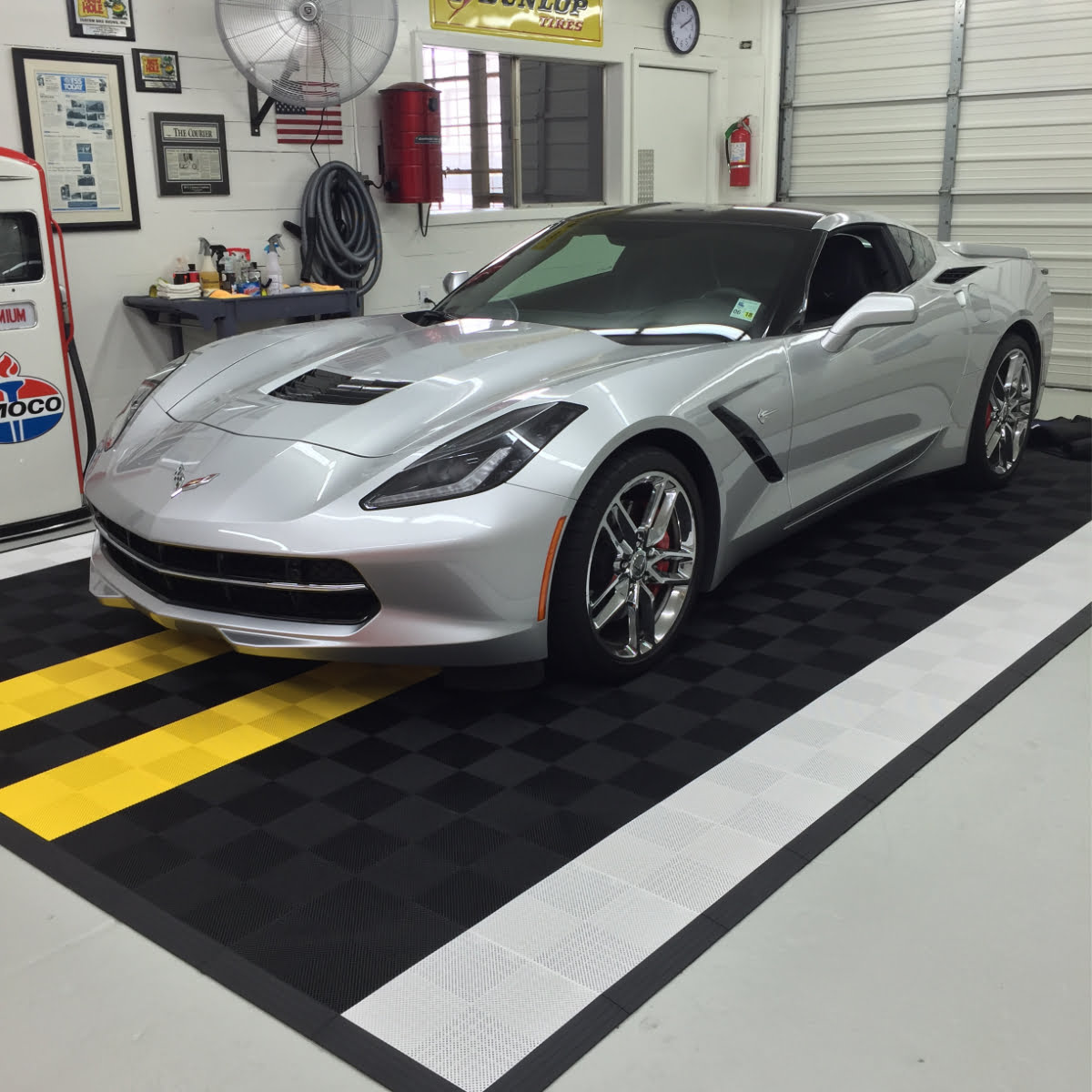 Corvette on a mat with our interlocking Perforated black, white and yellow tiles.