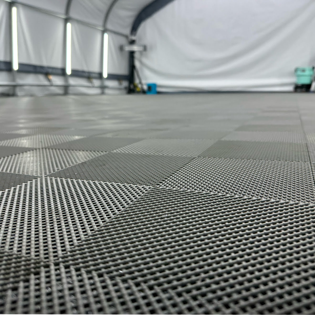 Up close Perforated garage tiles in gray.