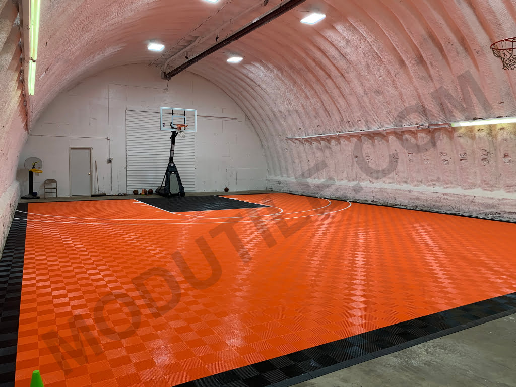 Indoor Facility basketball court black and orange